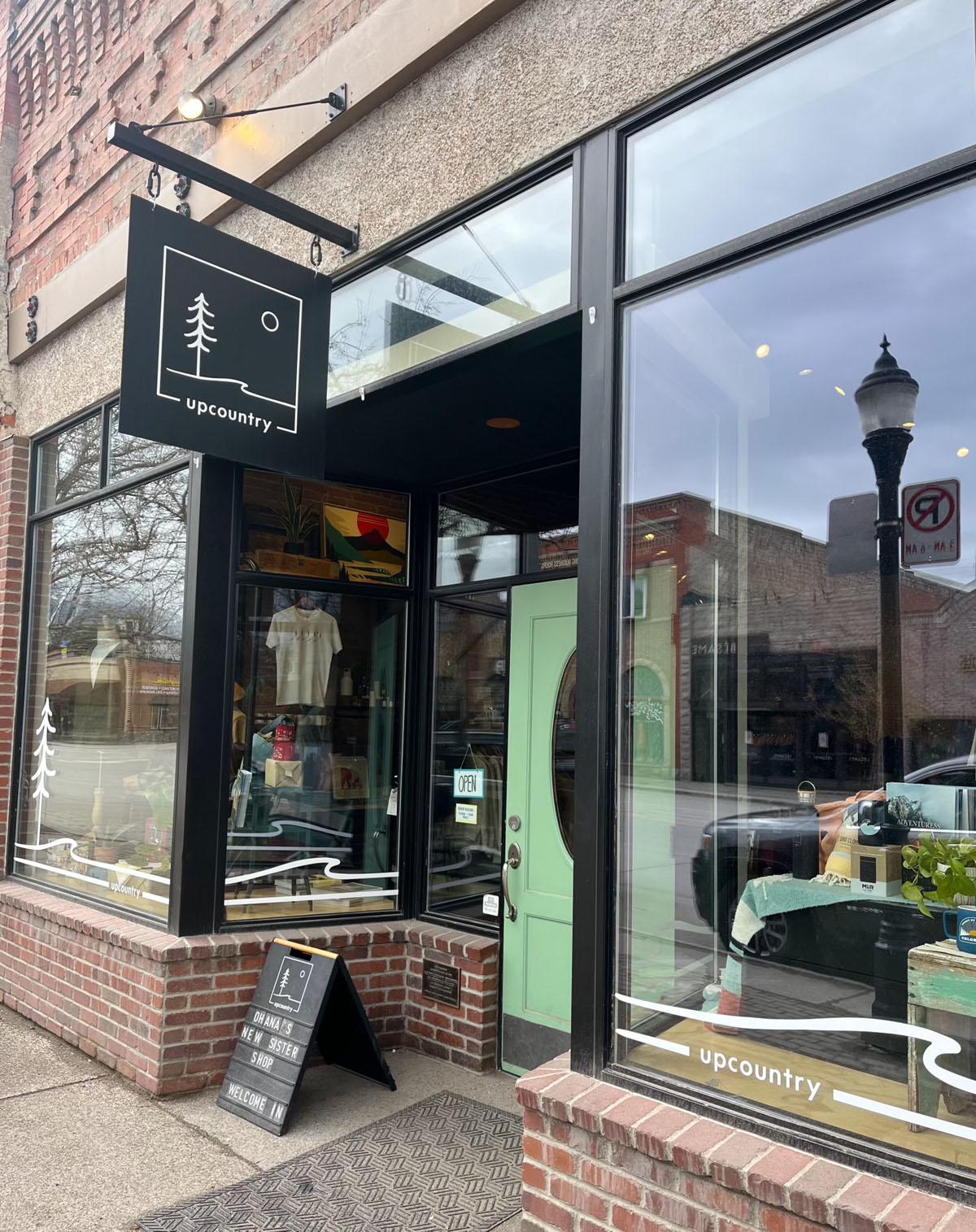 The Upcountry Steamboat storefront and window display.